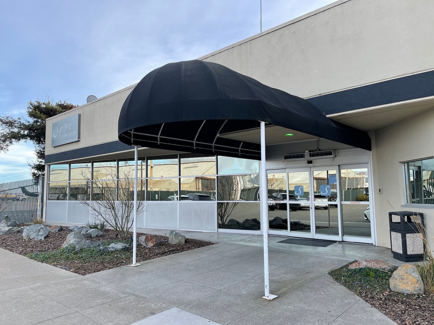 a building with a black awning