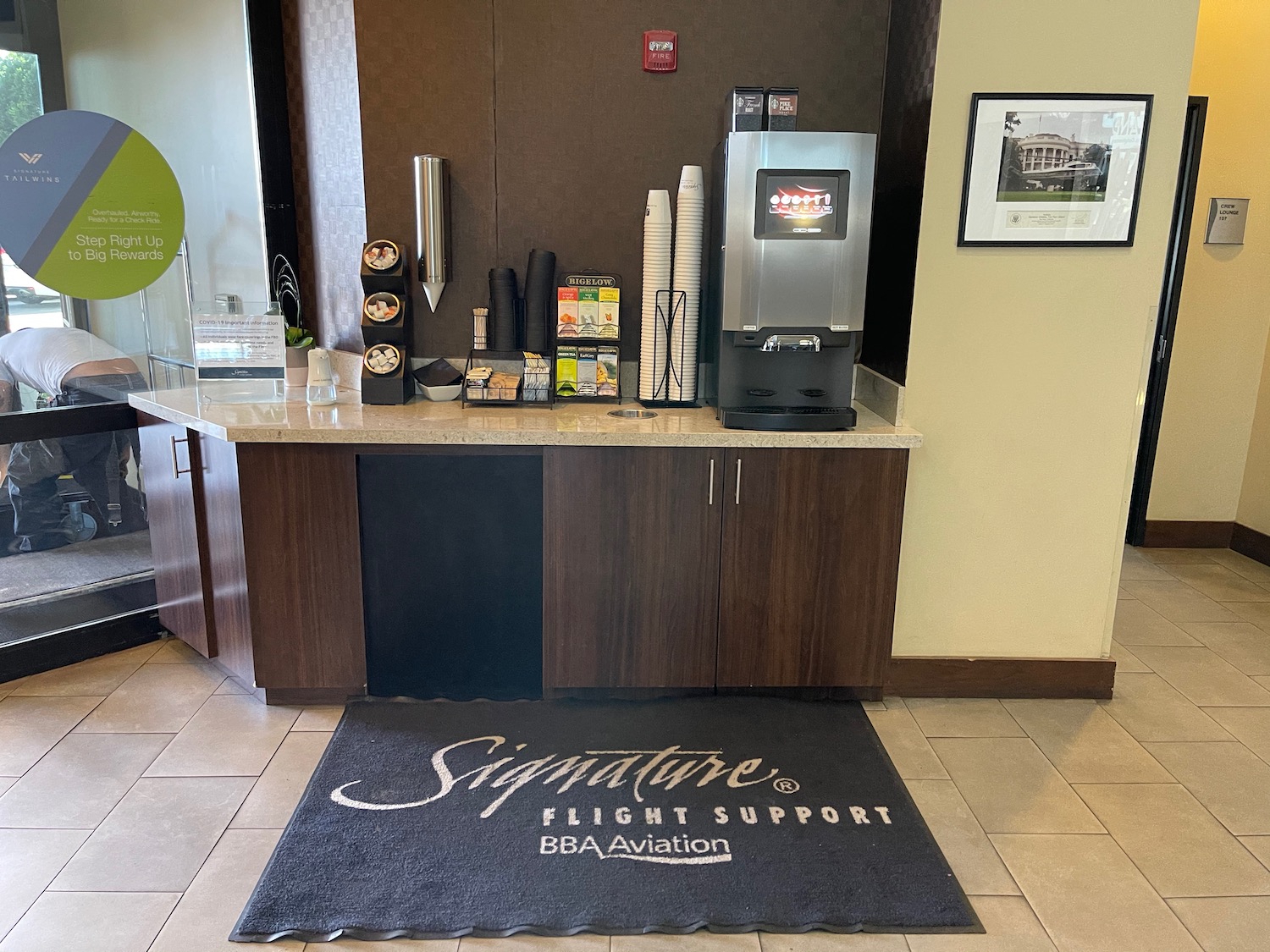 a coffee machine and a rug in a room