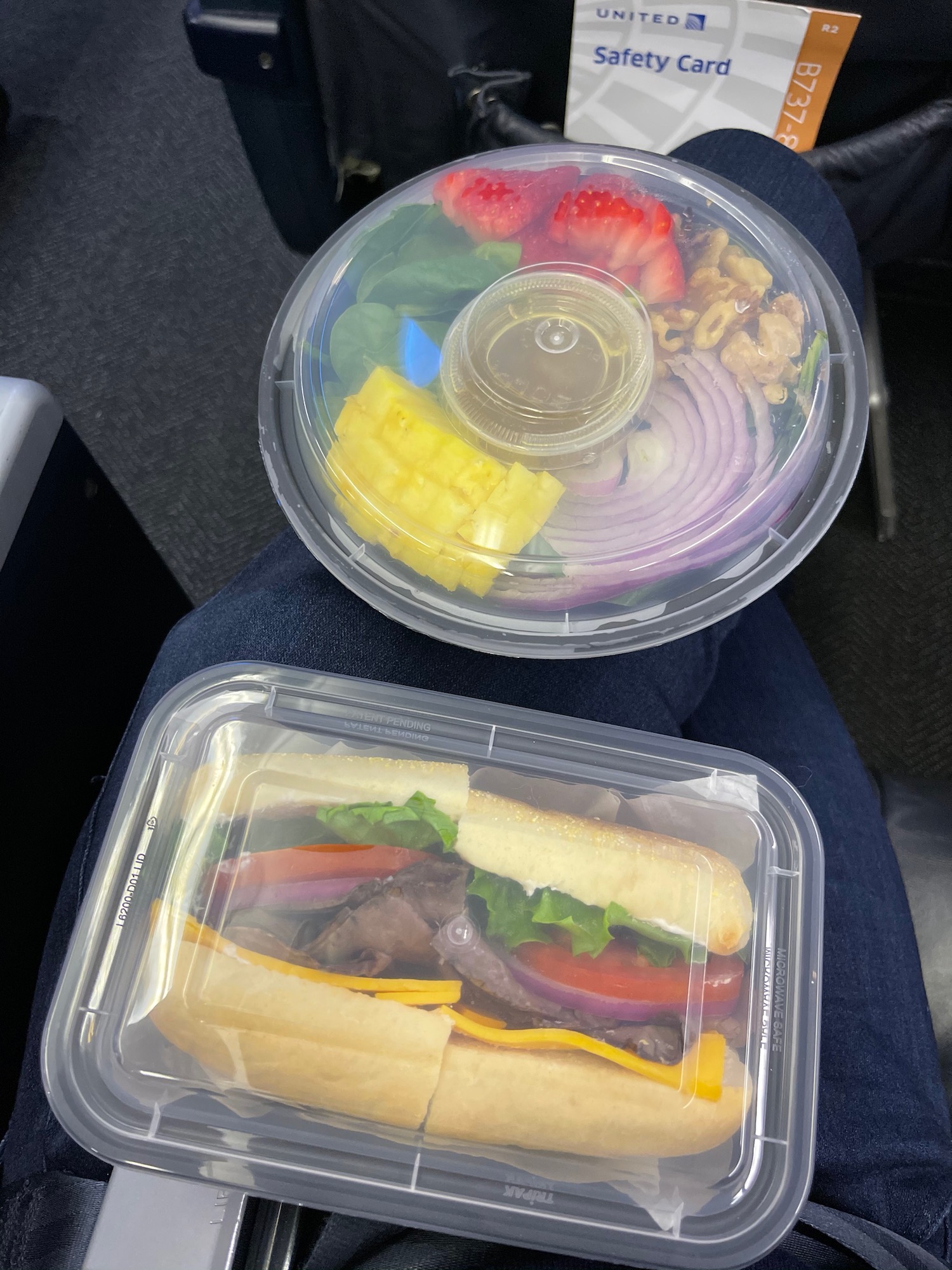 a couple of plastic containers of food
