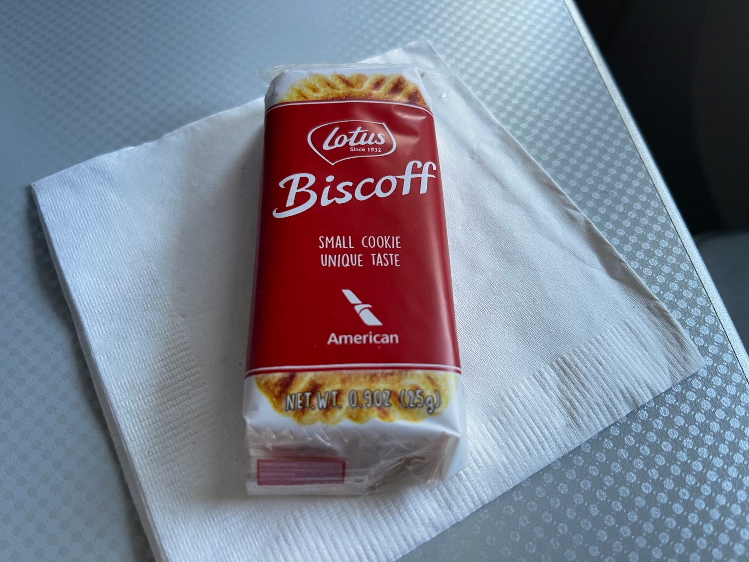 a red and white package of biscuit on a napkin