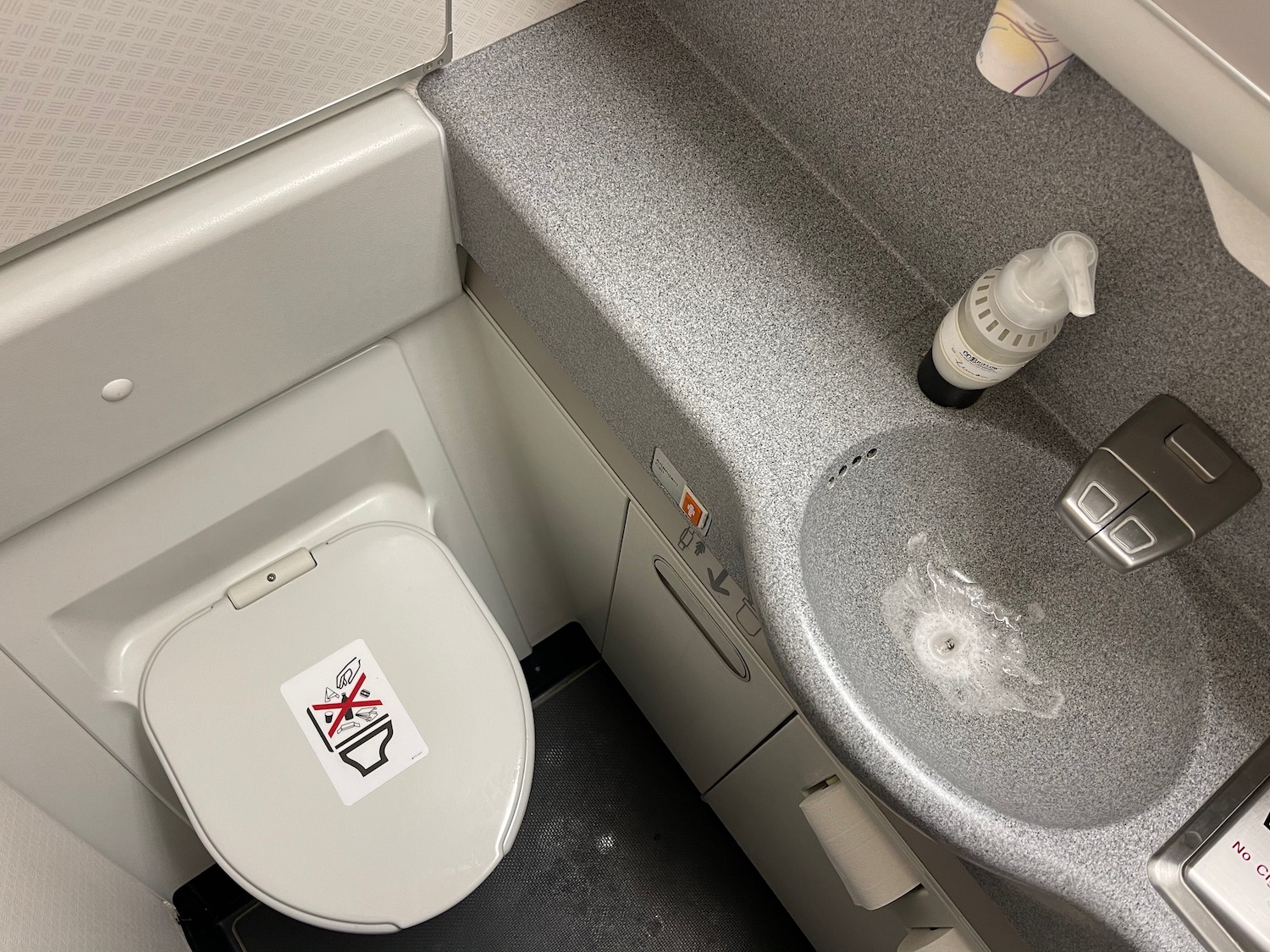 a toilet and sink in a bathroom