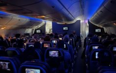 a group of people sitting in an airplane