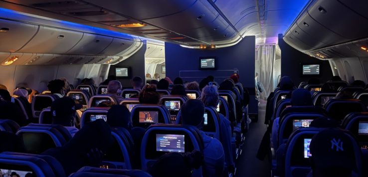 a group of people sitting in an airplane
