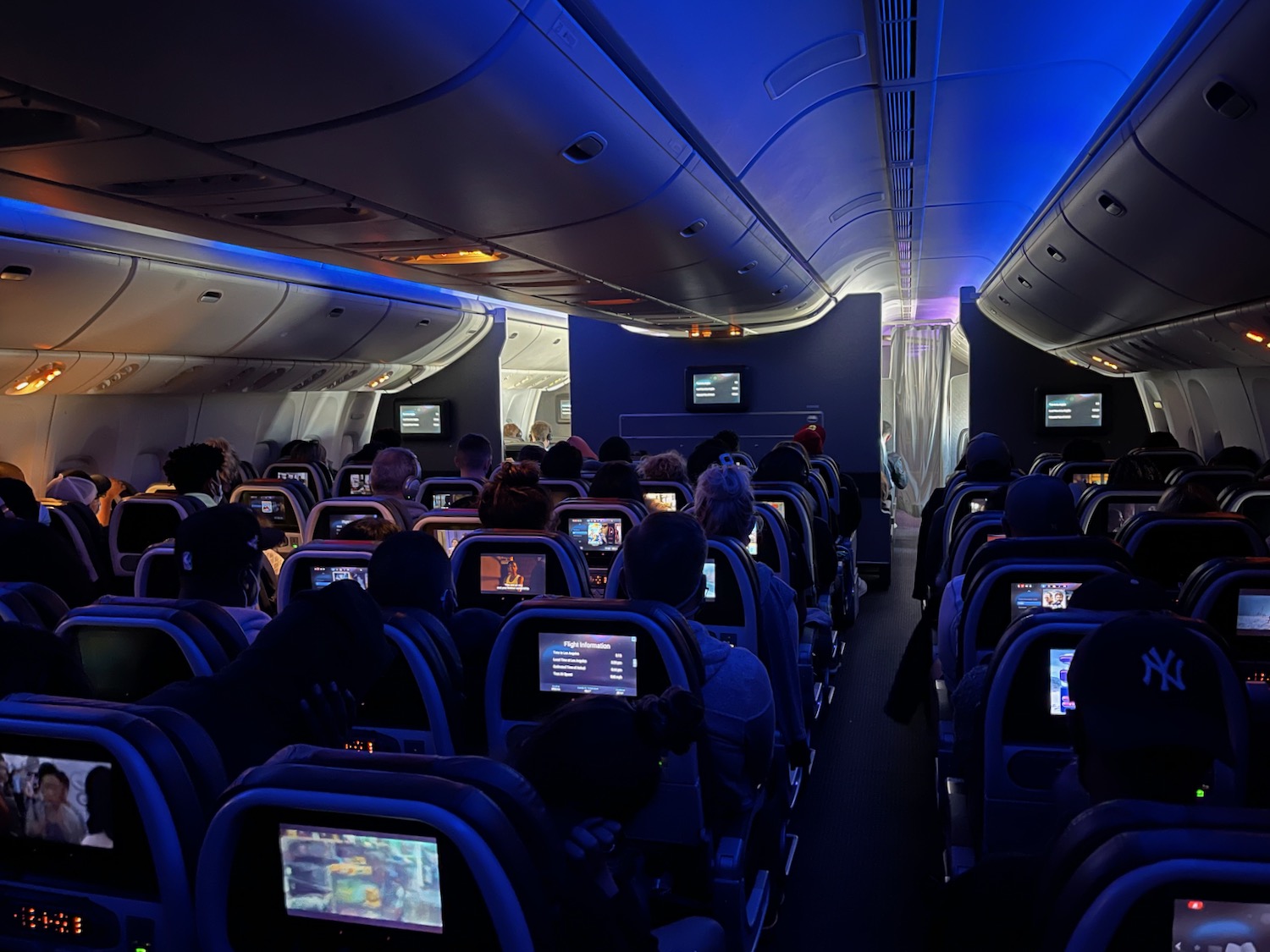 a group of people sitting in an airplane