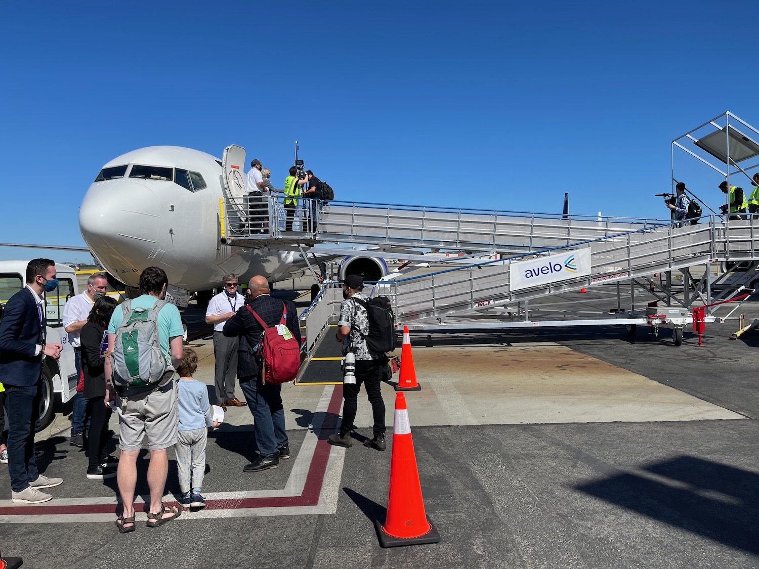 a group of people boarding an airplane