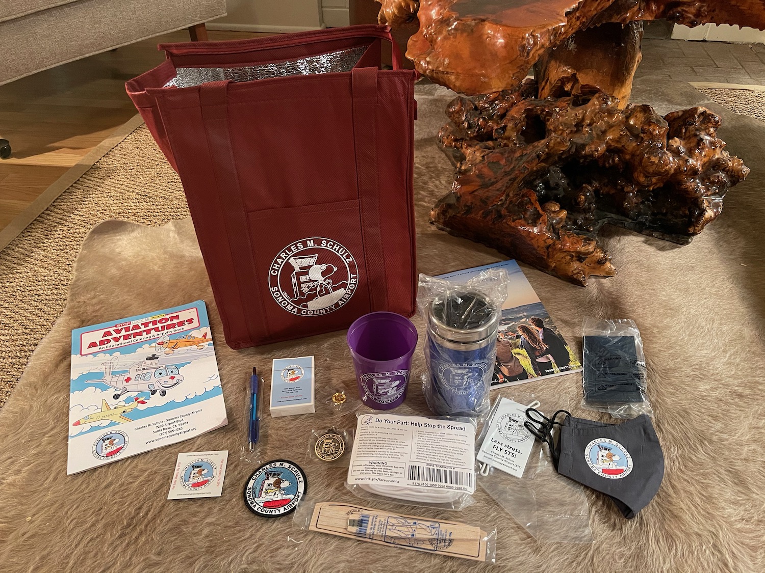 a bag and other items on a carpet