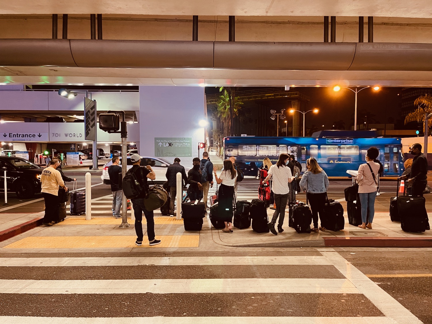 a group of people waiting at a train station