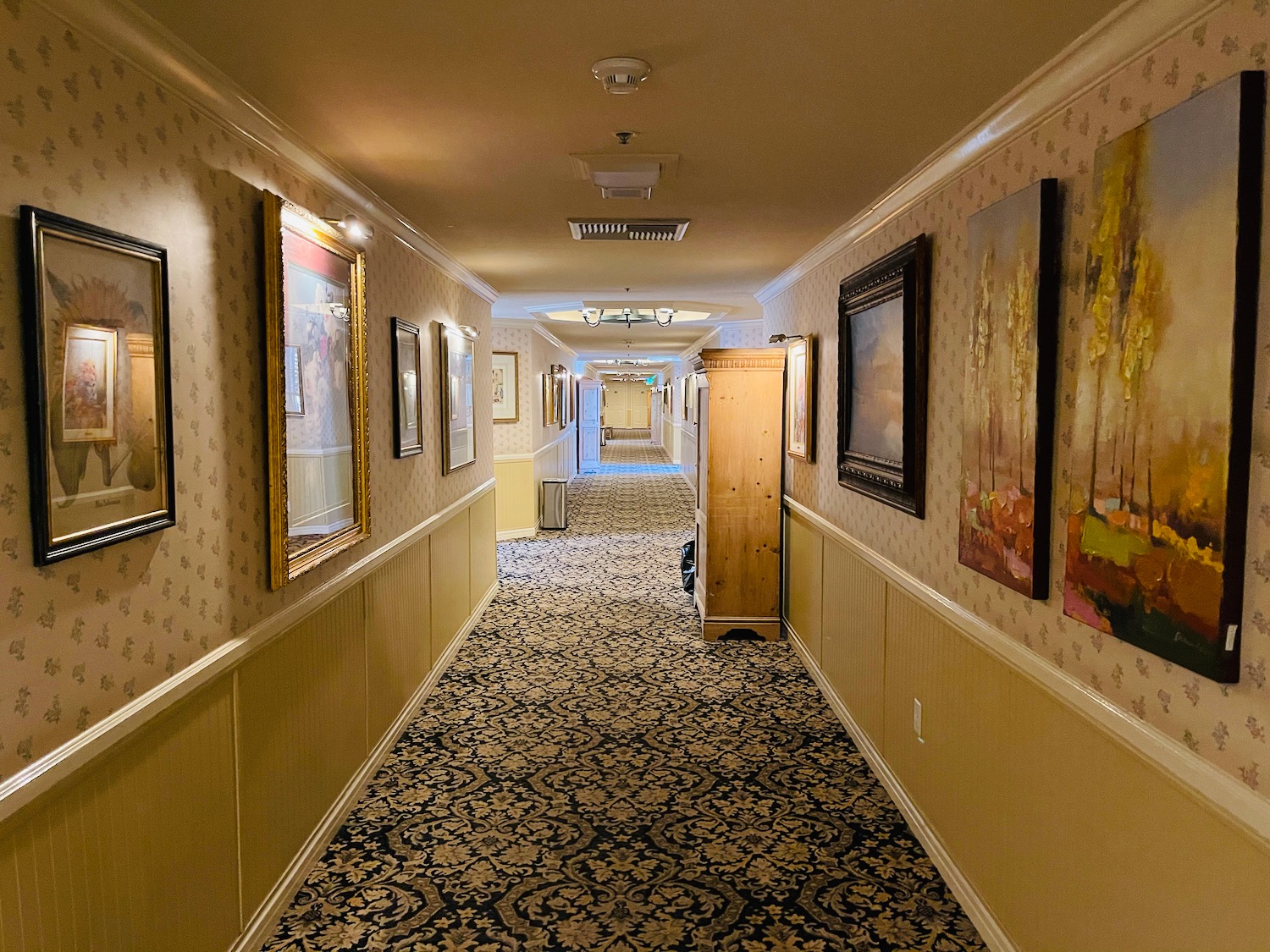 a hallway with paintings on the wall