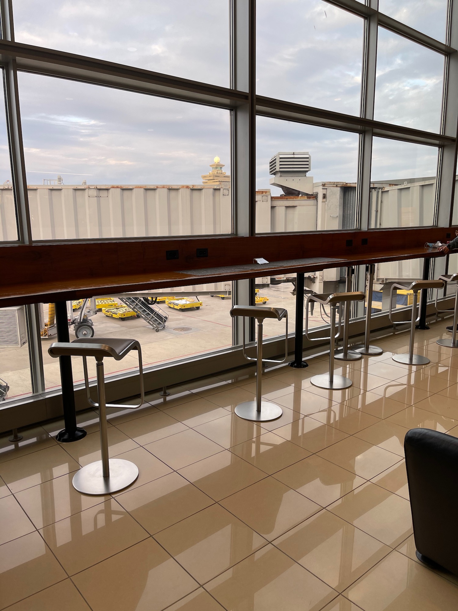 a bar stools in a room with a window