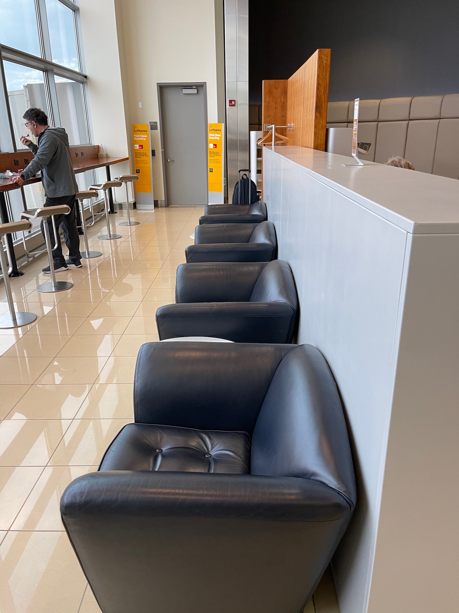 a row of black chairs in a room