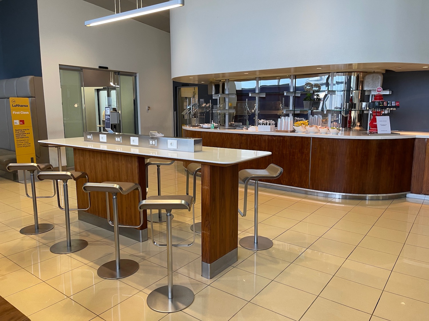 a bar with stools and a counter