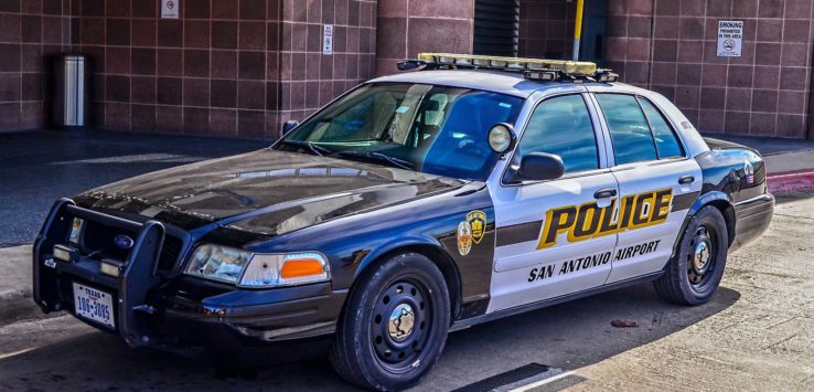 a police car parked on the side of a road