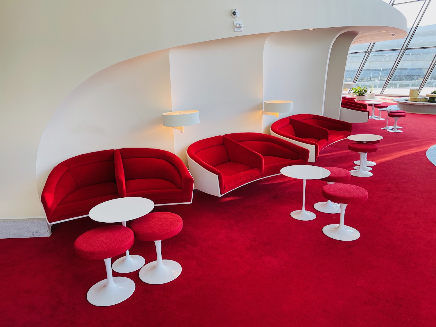 a red couches and tables in a room