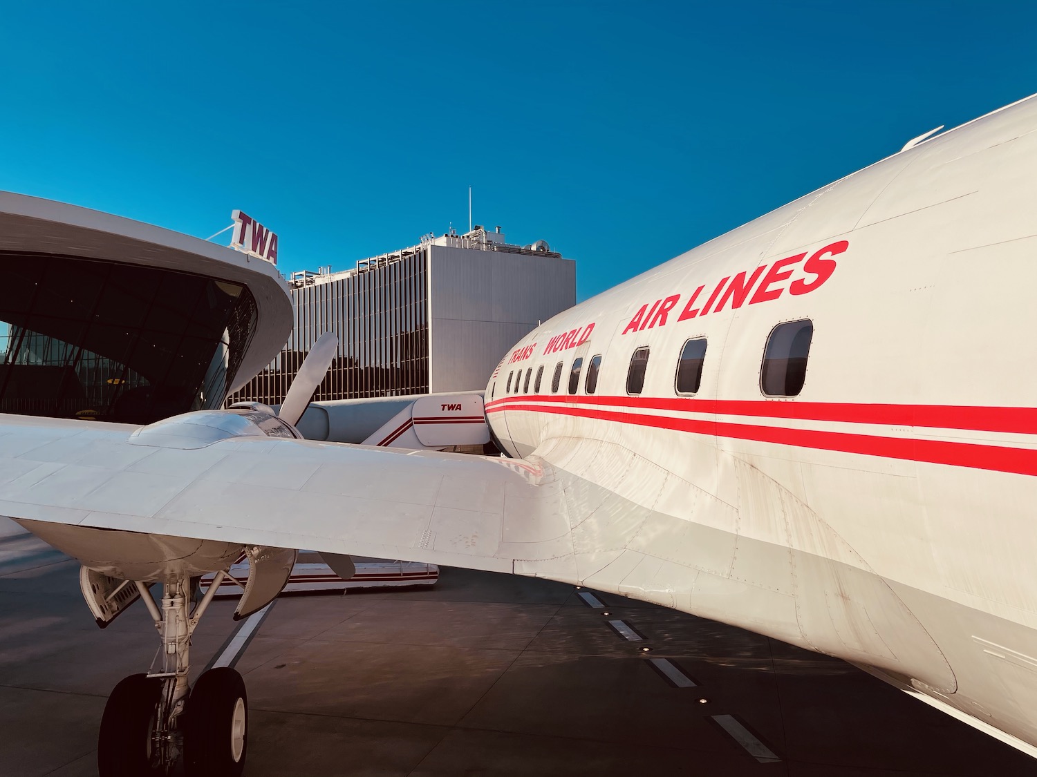 a white airplane with red writing on it