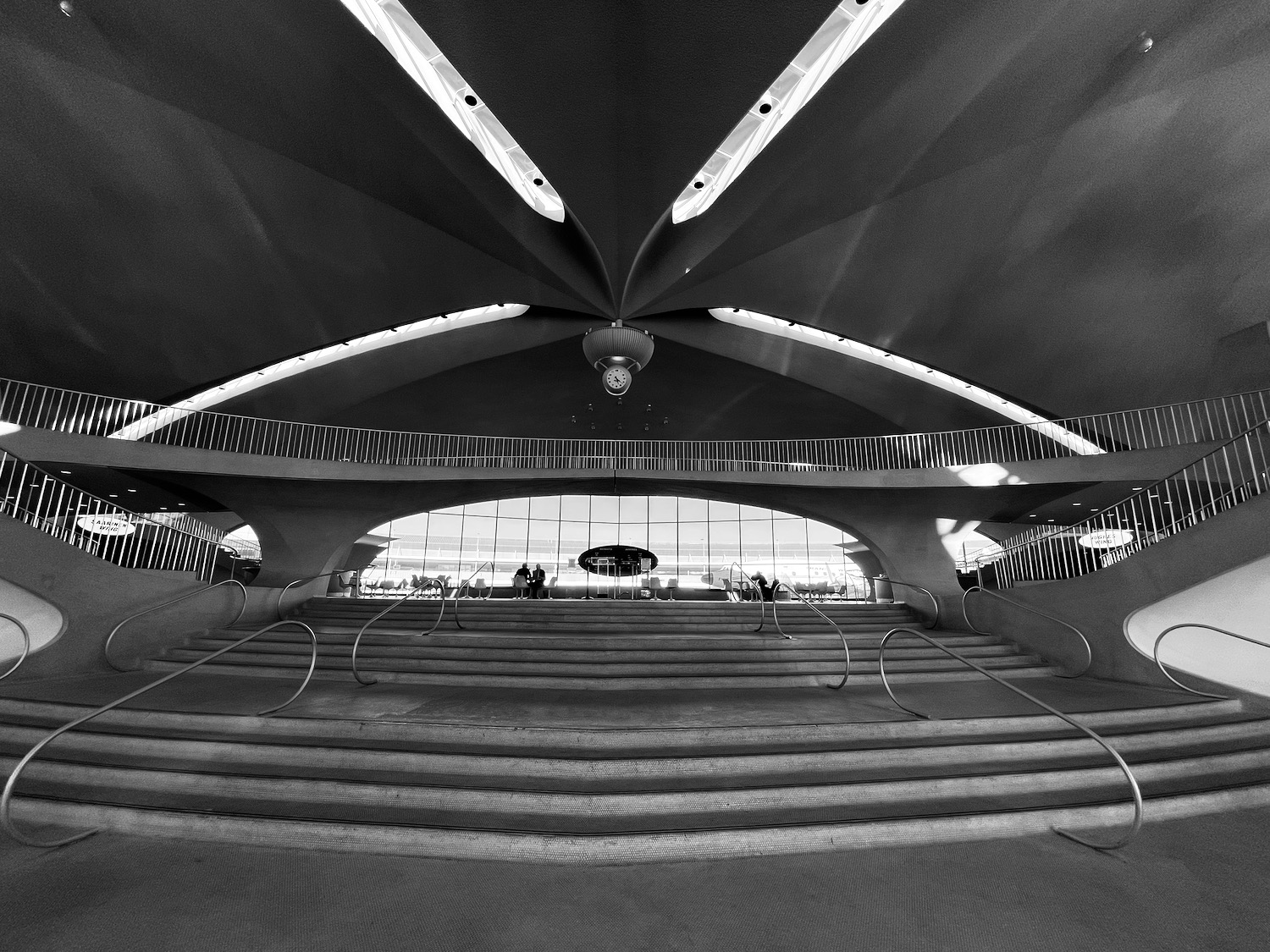 a black and white photo of a staircase