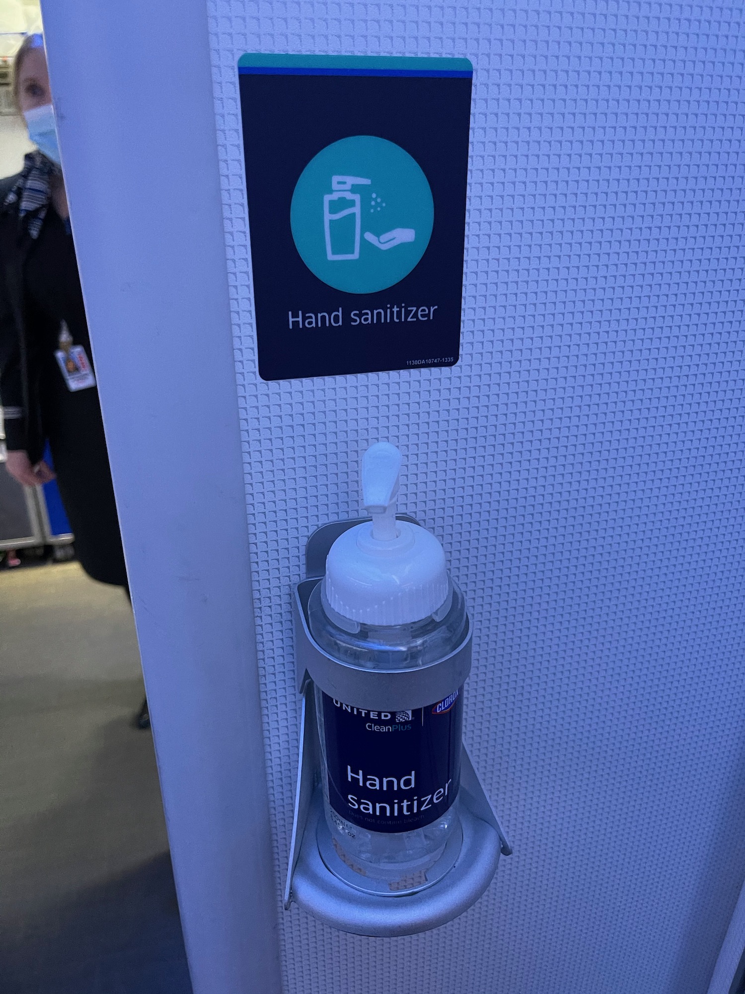 a hand sanitizer dispenser on a wall