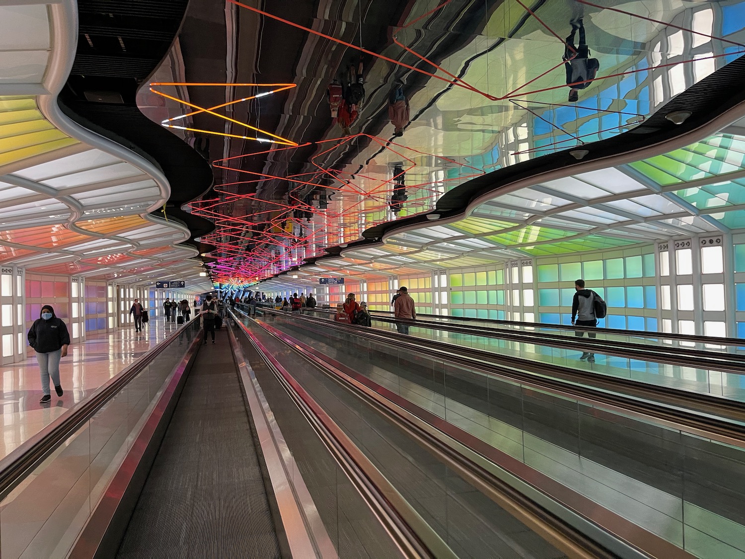 a group of people on an escalator