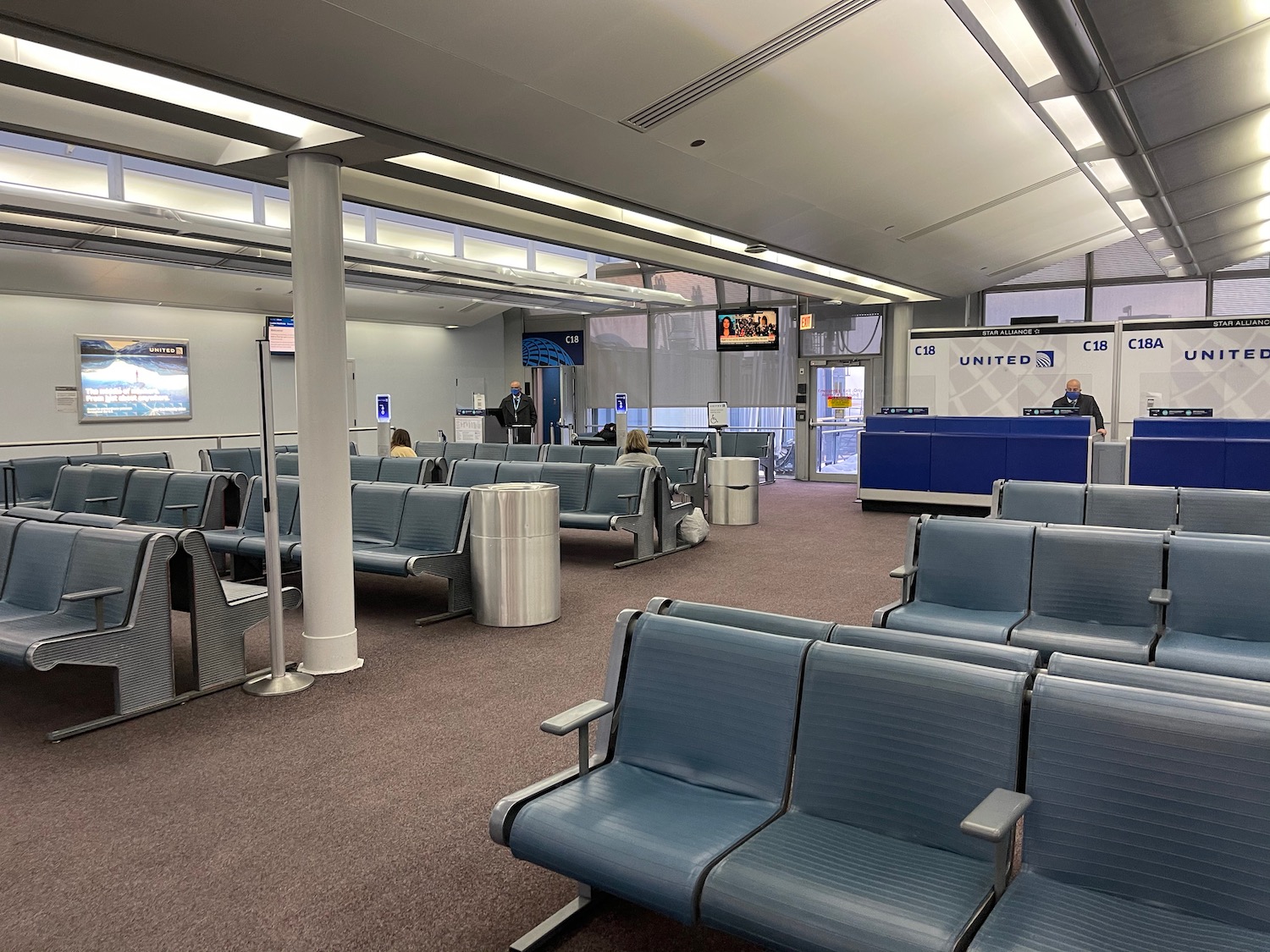 a group of people in an airport waiting area