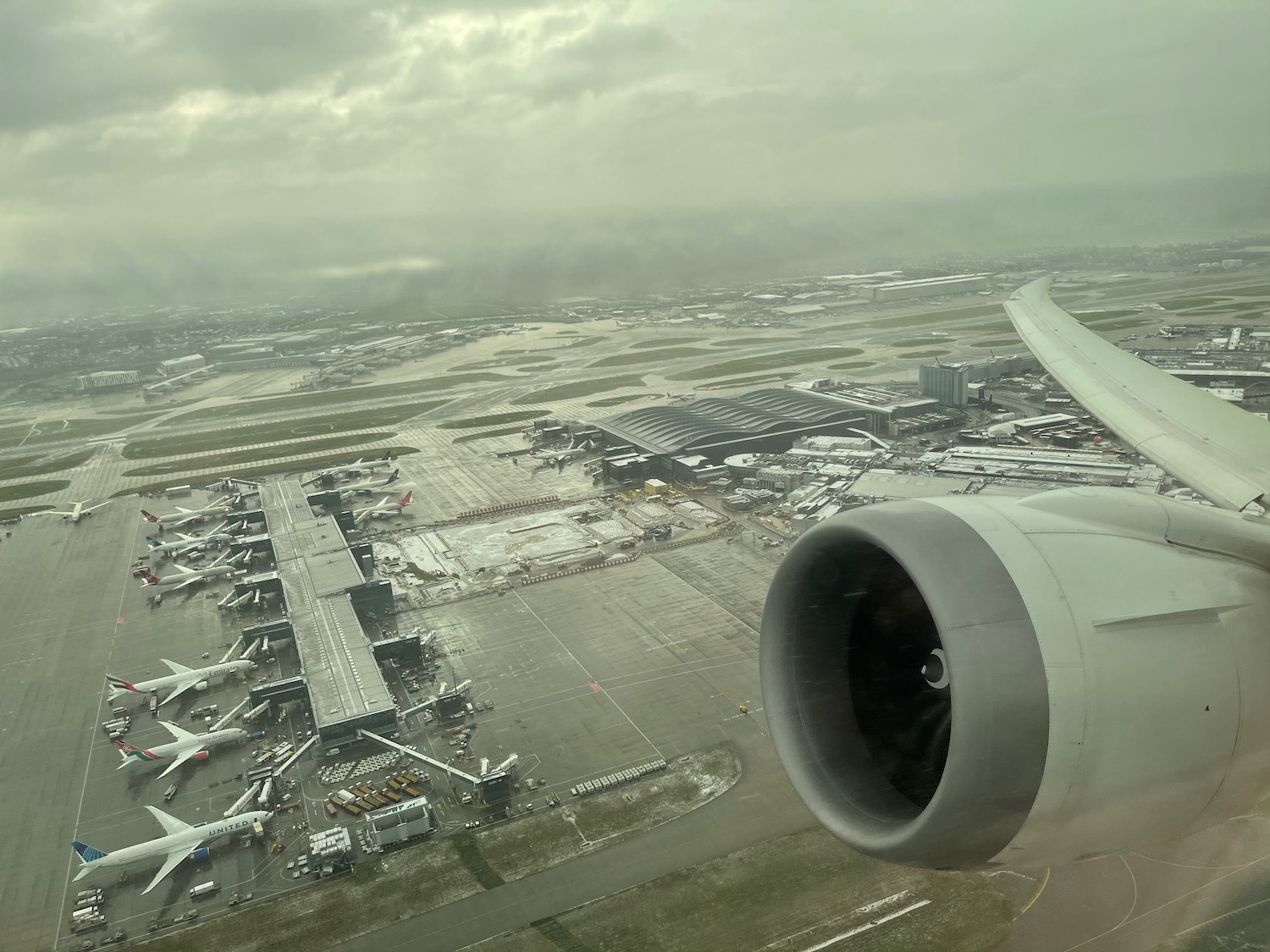 an airplane wing and engine of an airplane in an airport