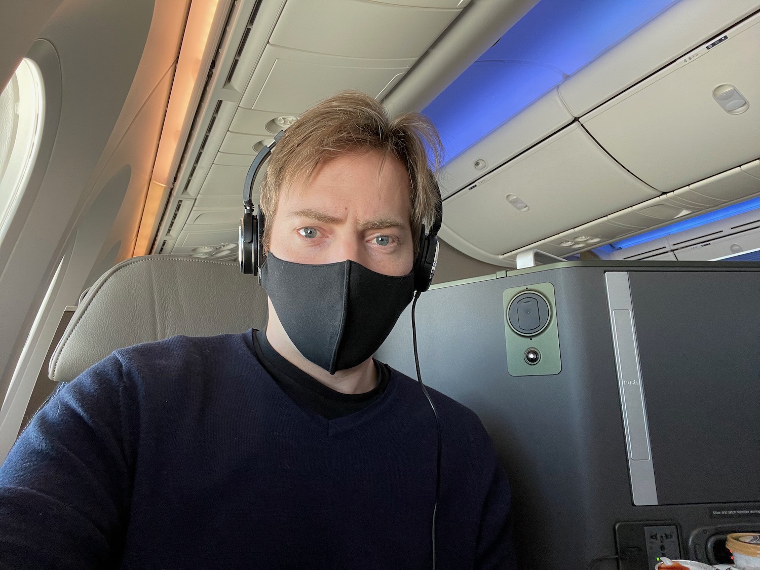 a man wearing a face mask and headphones