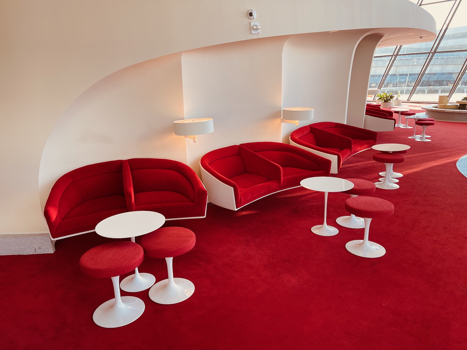 a red couches and tables in a room