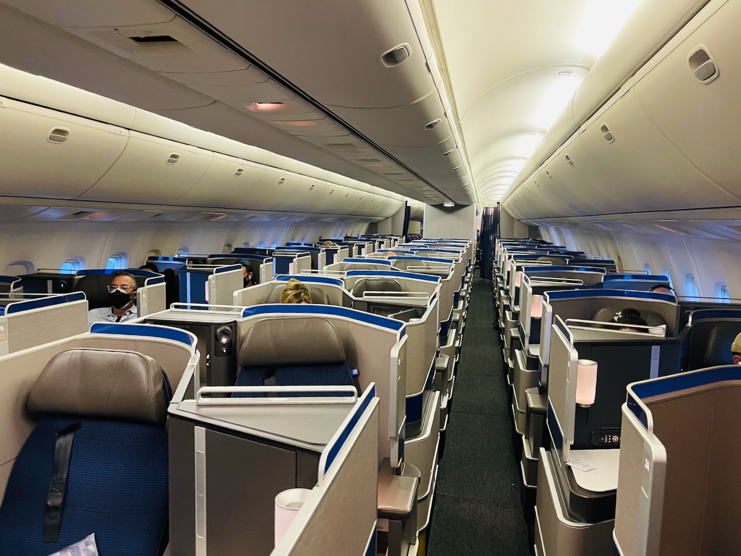 a plane with seats and people in it