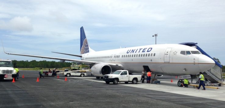 a white airplane on a runway