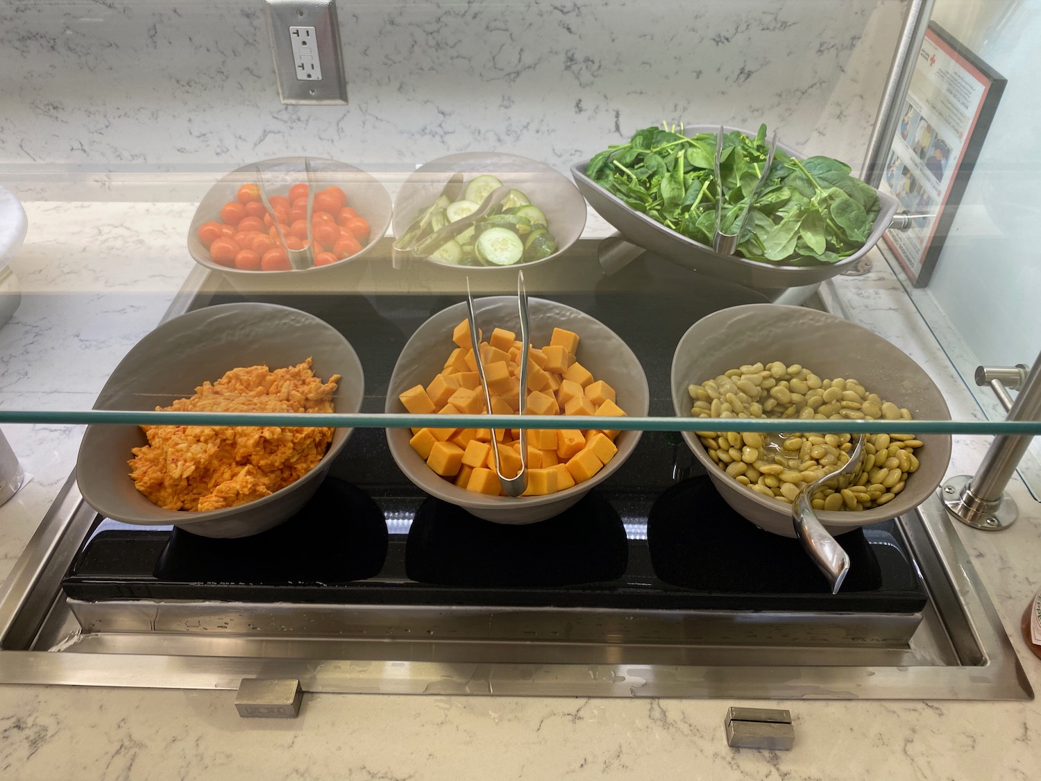 a buffet display with bowls of food