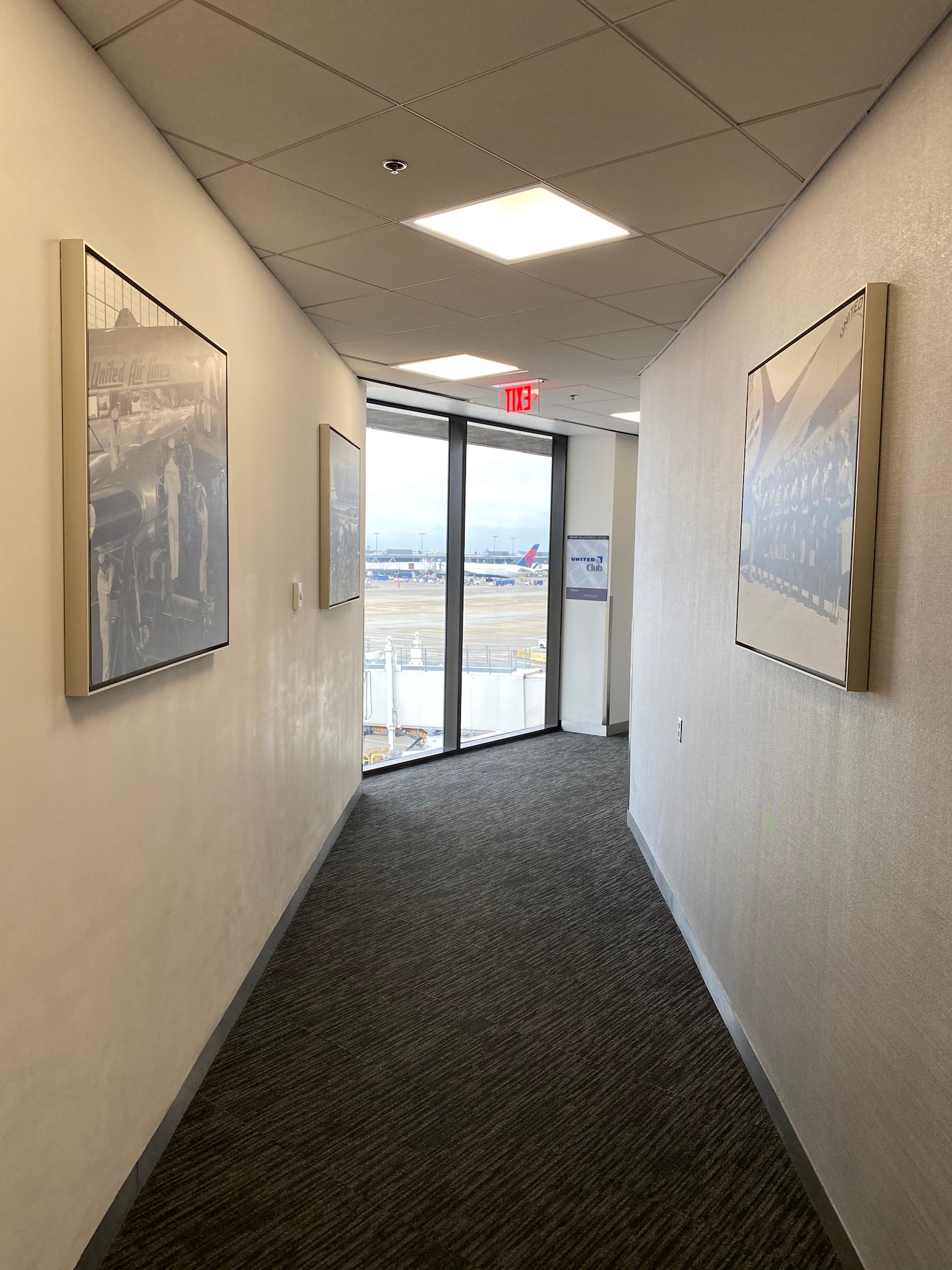 a hallway with pictures on the wall