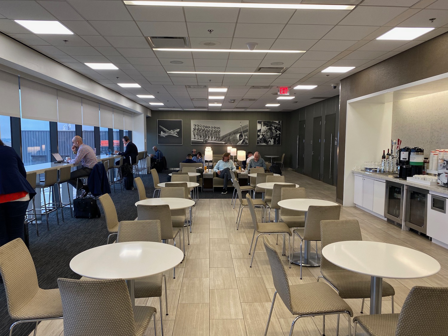 a group of people sitting at tables in a room