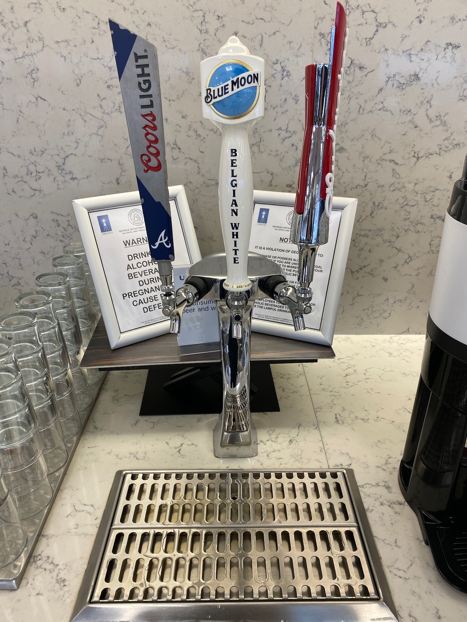 a group of beer taps on a counter