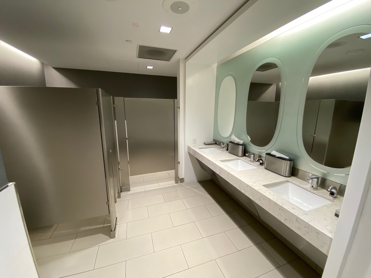 a bathroom with sinks and mirrors