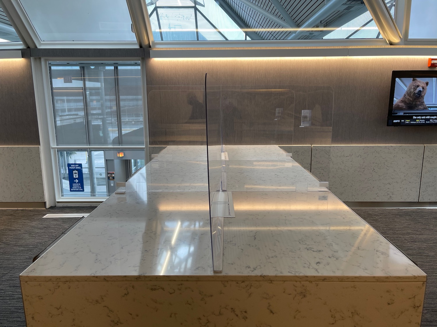 a white counter with clear plastic panels