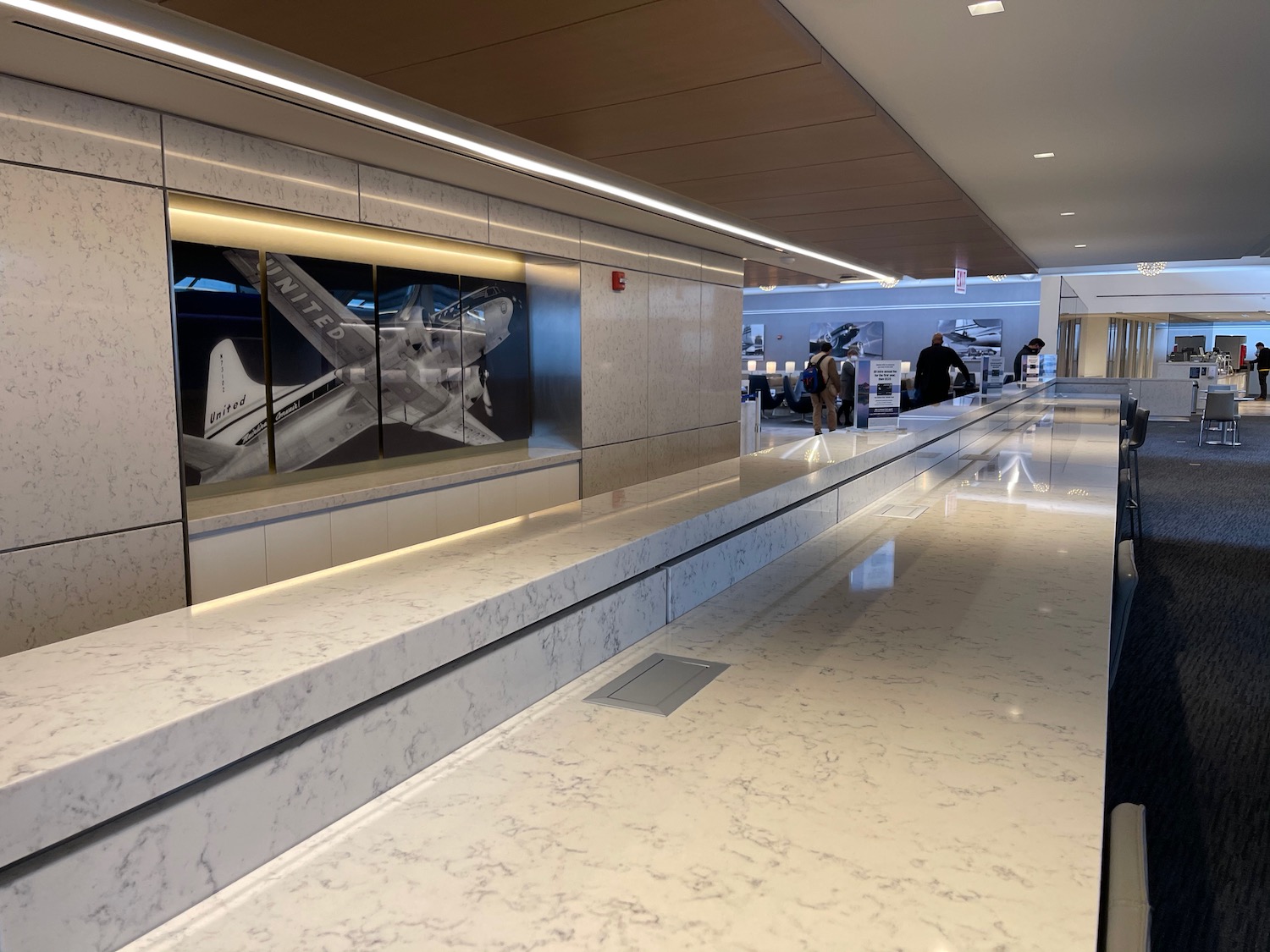 a marble floor with a large window with airplanes on it