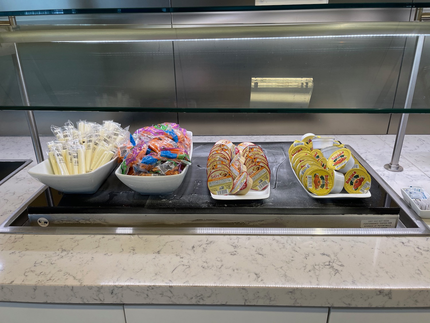 a group of bowls of food on a counter