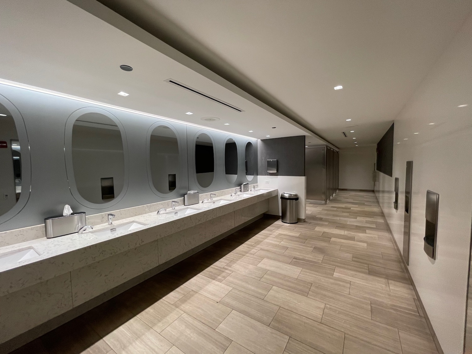 a bathroom with sinks and mirrors