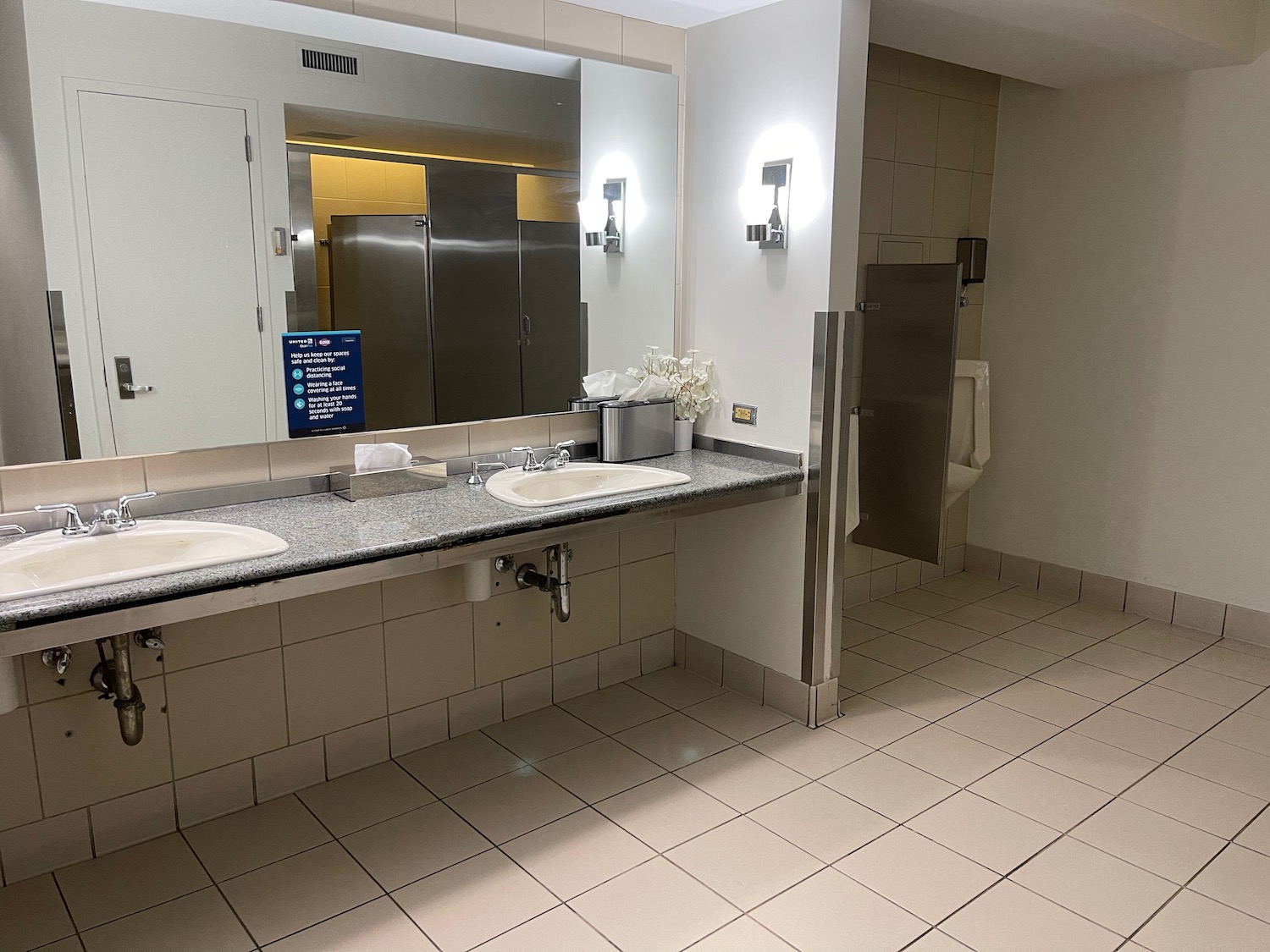 a bathroom with sinks and a mirror