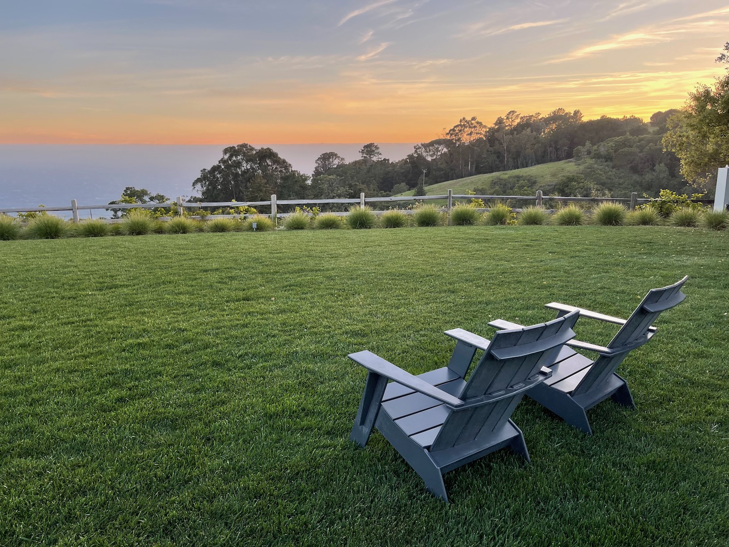 two chairs on a grassy lawn