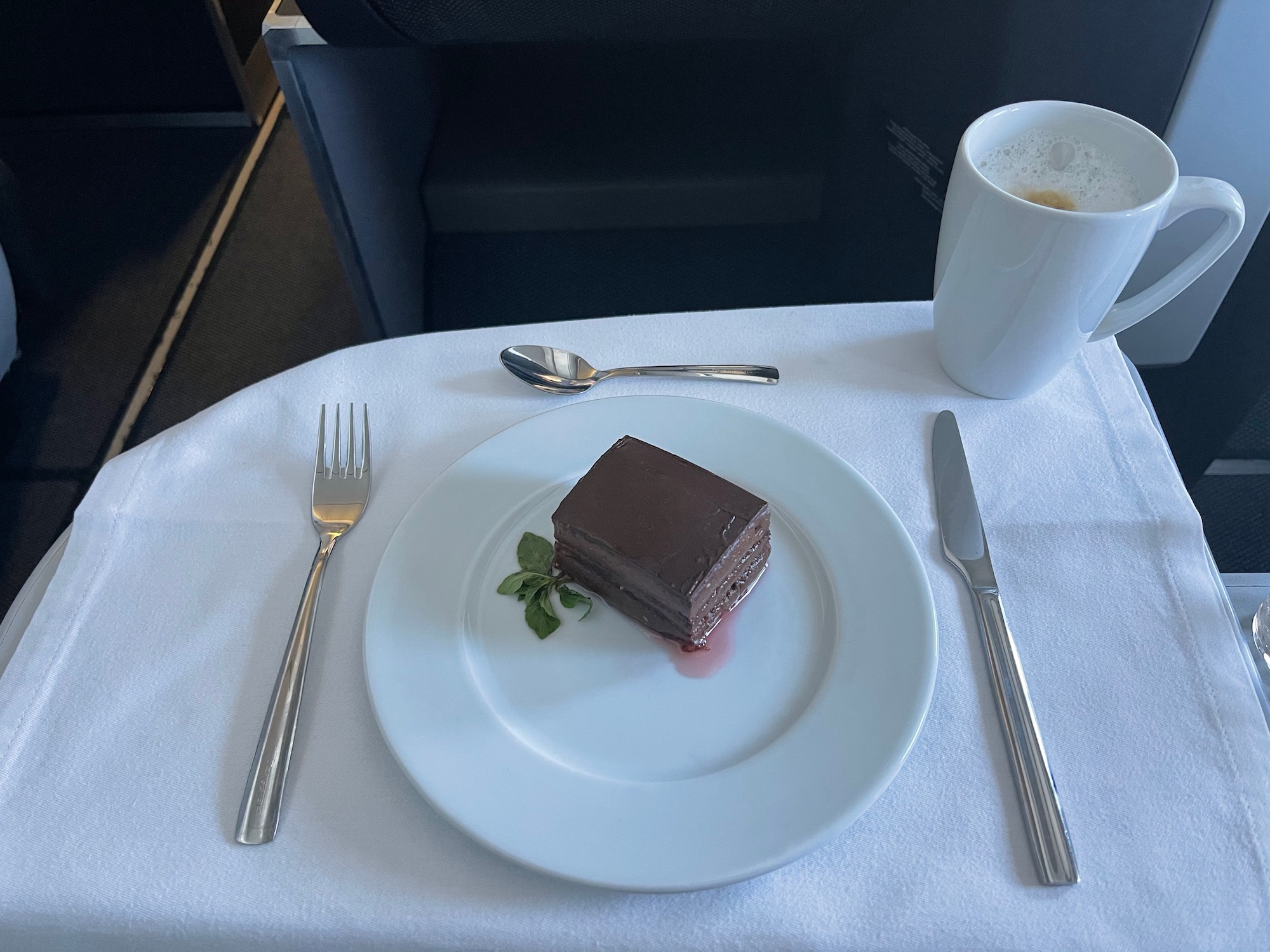 a plate of chocolate cake and a cup of coffee