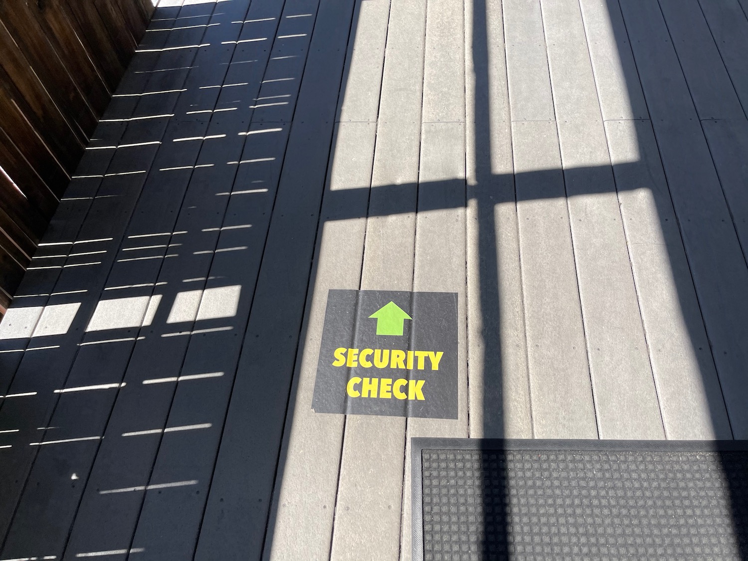 a sign on a wooden deck