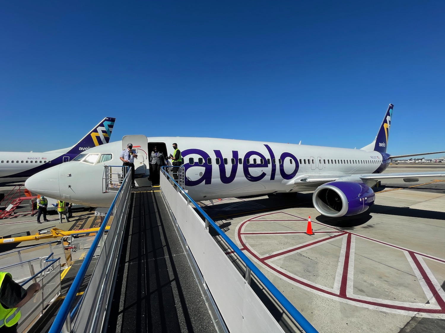 a plane with people boarding