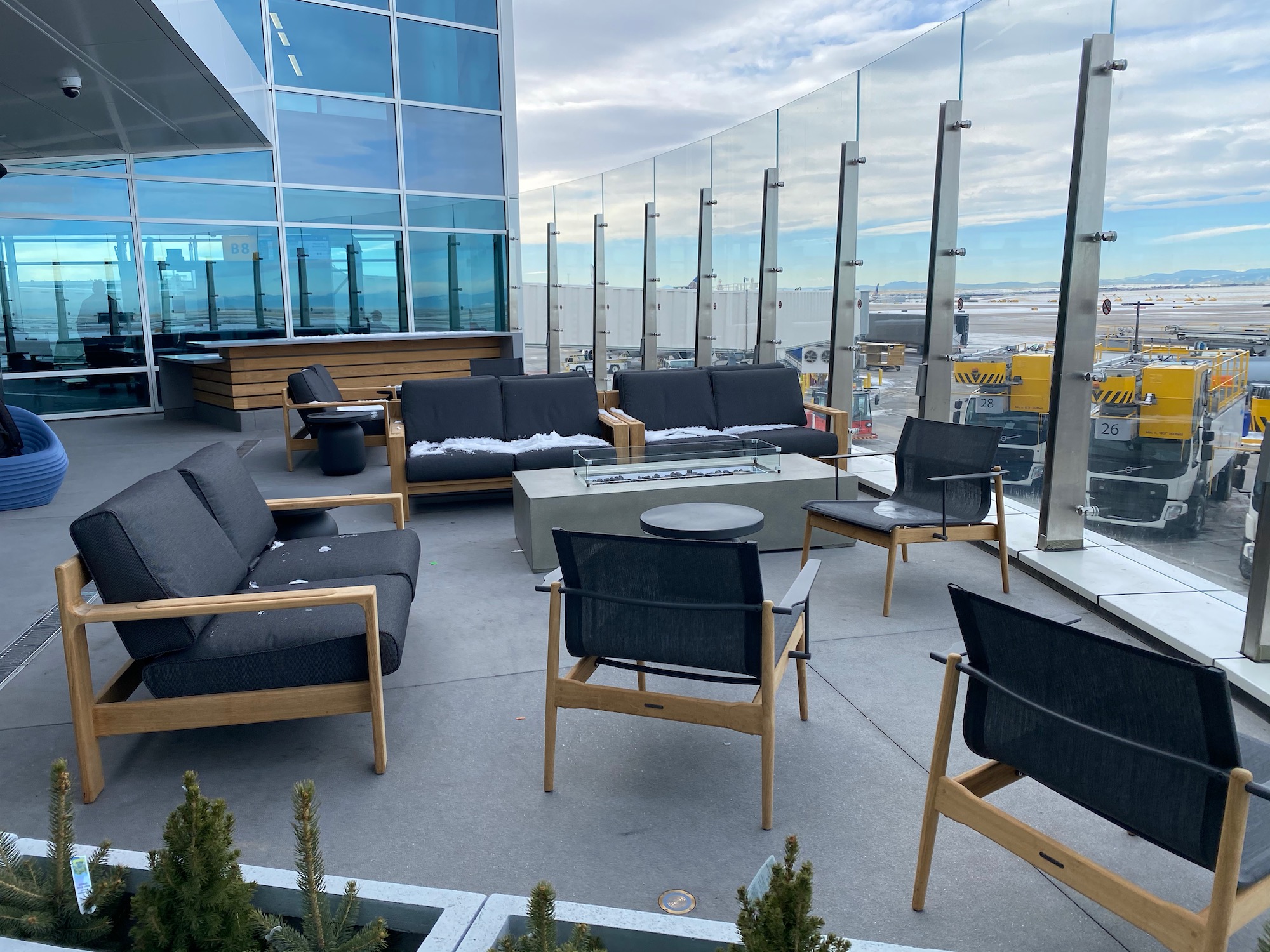 a patio with chairs and a table