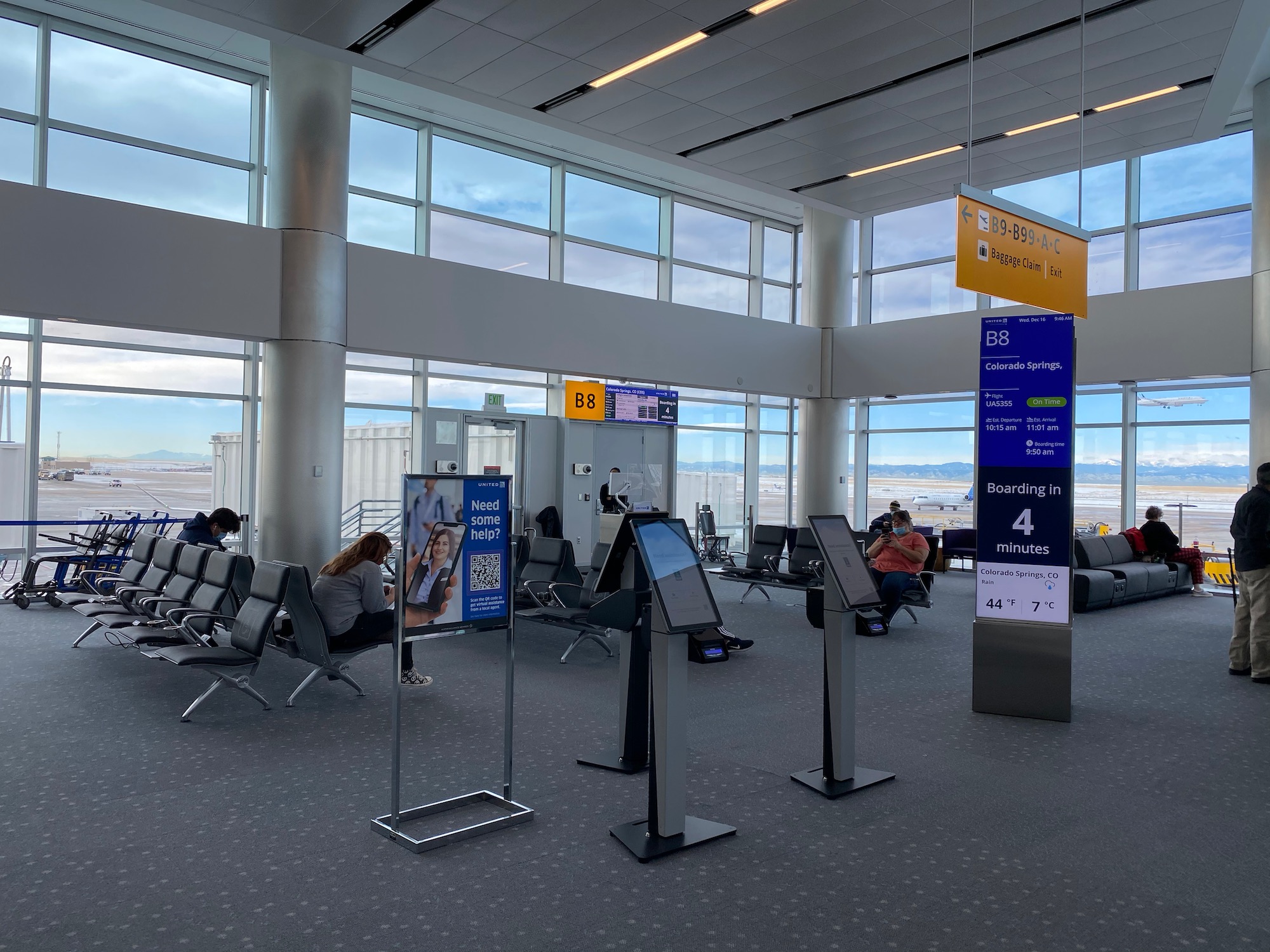 people sitting in an airport terminal