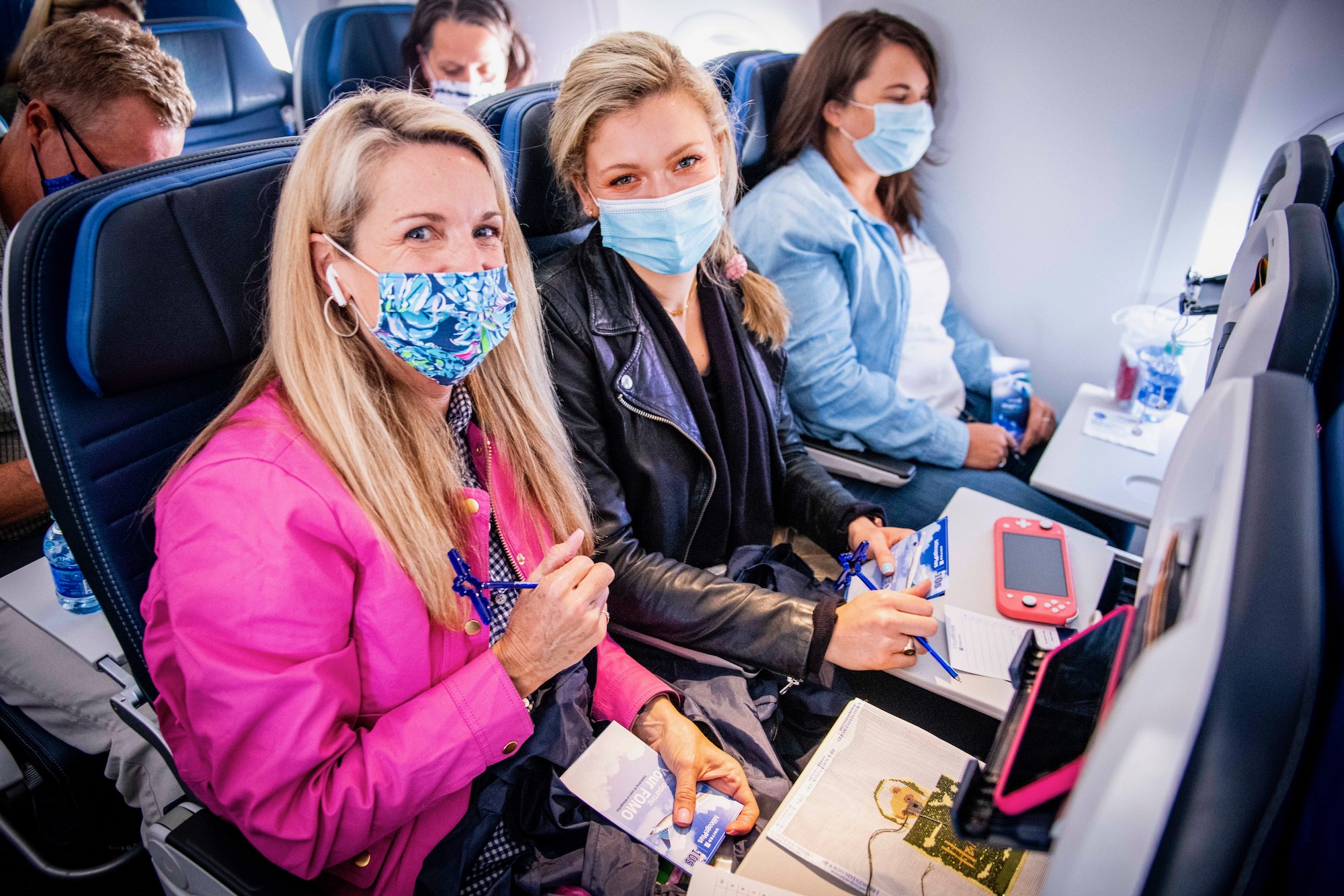 a group of women wearing face masks