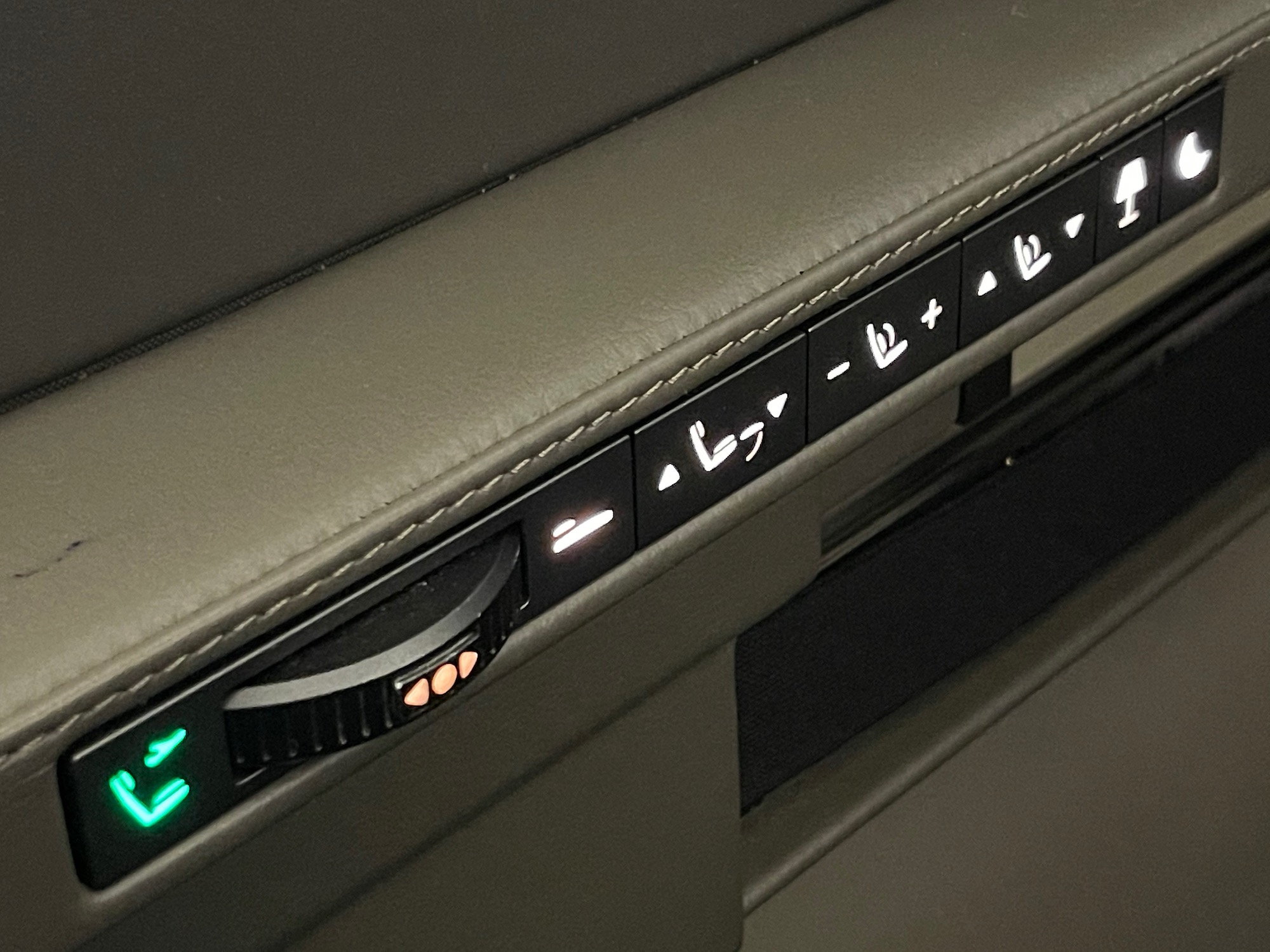 a close up of a seat control panel