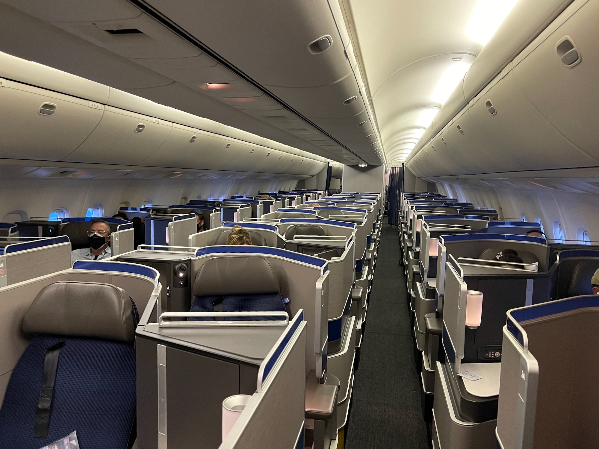 a plane with seats and people in it