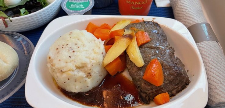 a plate of food on a tray