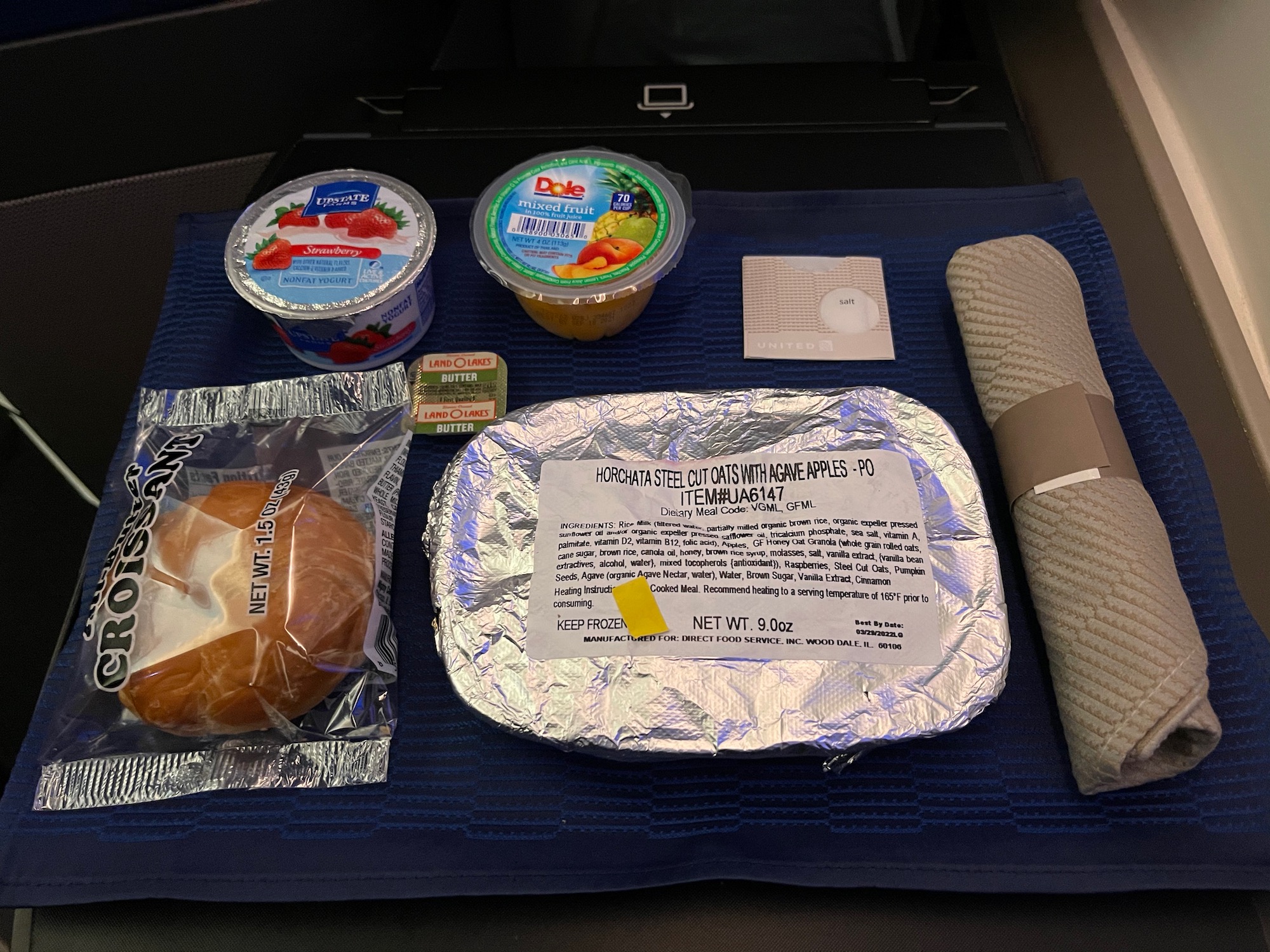 food on a mat in a plane