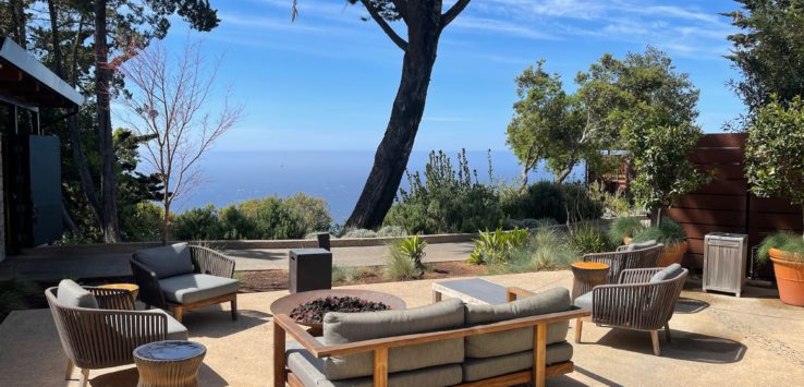 a patio with furniture and trees