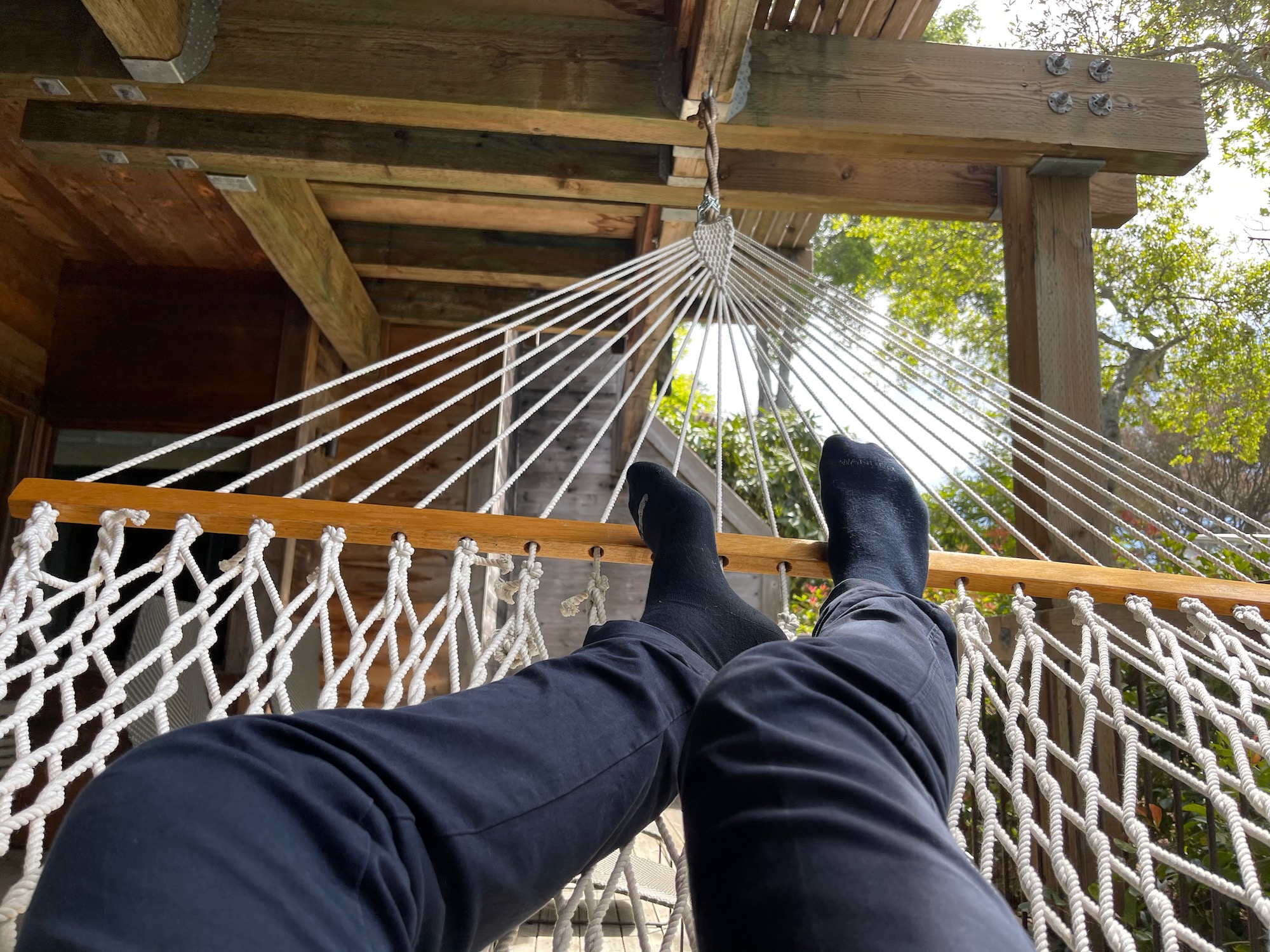 a person's feet in a hammock